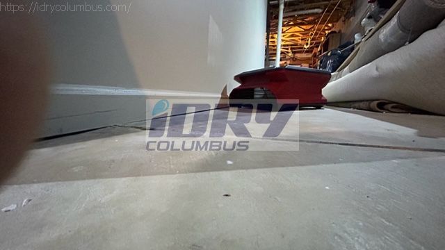 air mover rental setup to move air along baseboard and low 2' of water damaged drywall. - iDry Columbus