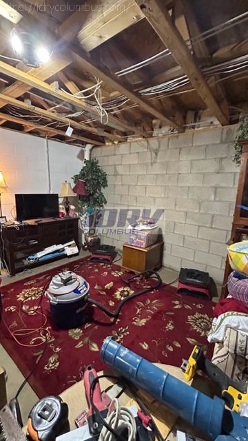 basement water damage due to broken water supply line. Water damage to contents and area rugs. - iDry Columbus