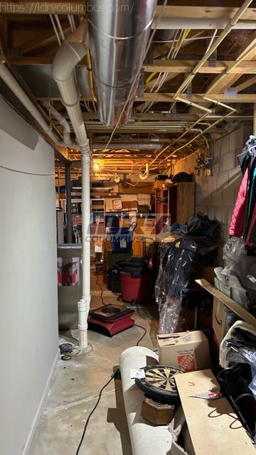 drying equipment setup during a residential flooded basement water cleanup. Water damage to drywall, base and personal property. - iDry Columbus