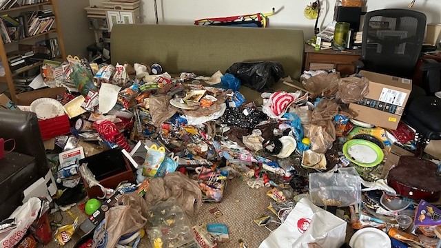Extreme hoarding cleanup with large amounts of trash, food and waste thrown about a residence